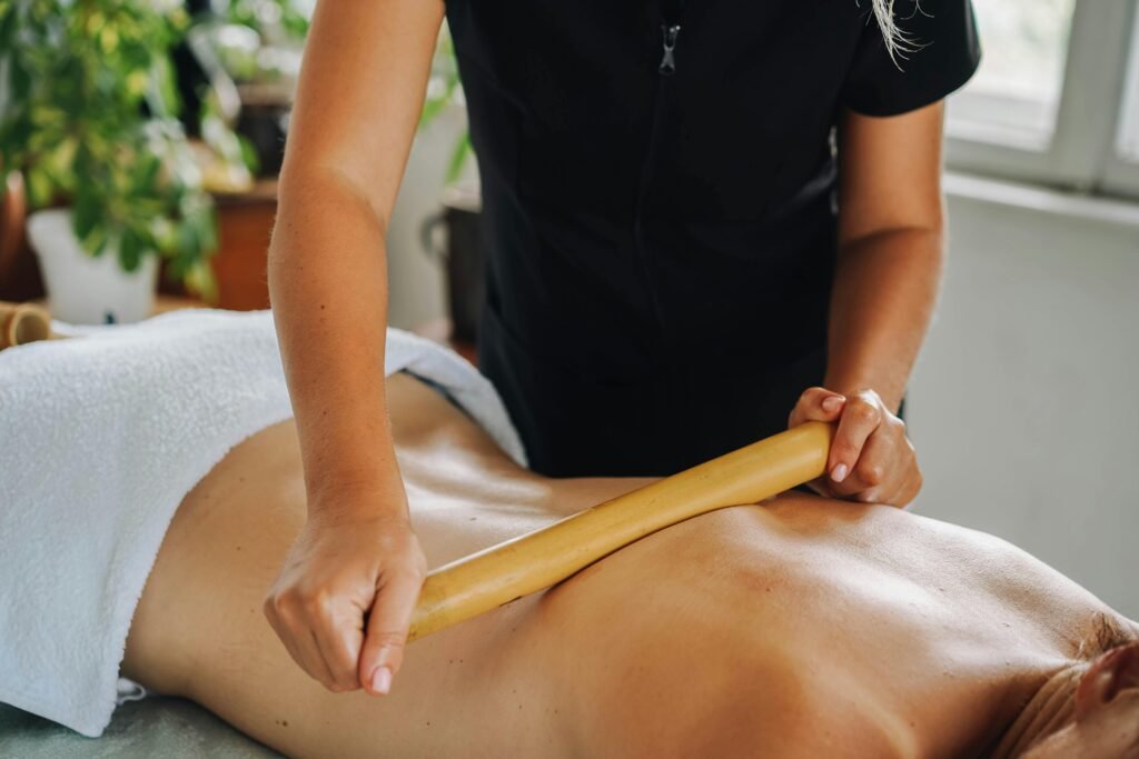 Experience ultimate relaxation with a rejuvenating bamboo massage in a tranquil spa setting.